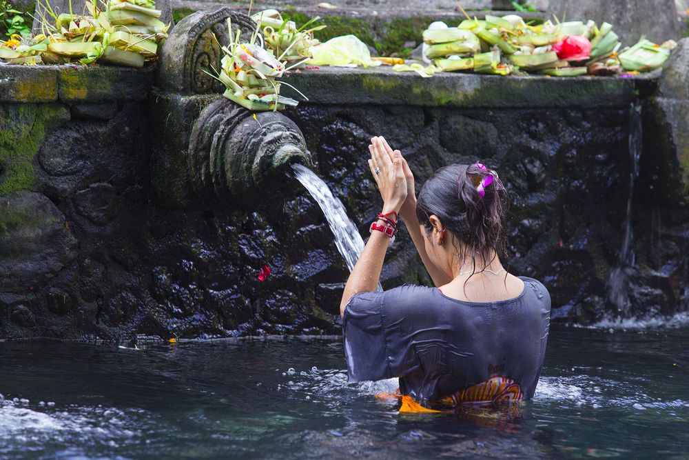 Holy Spring Water Tirta Empul Hindu Temple , Bali Indonesia © Shutterstock